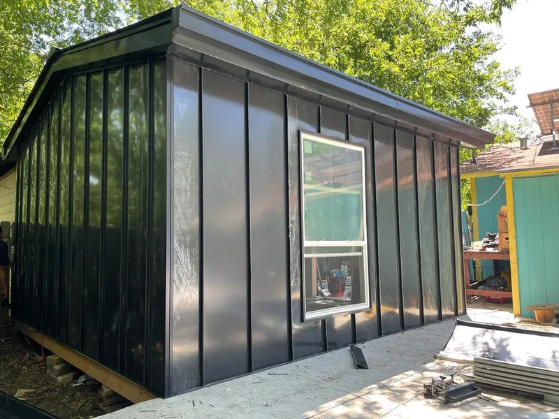 Black standing seam metal wall panels for Roof Inspection in Gloucester Point